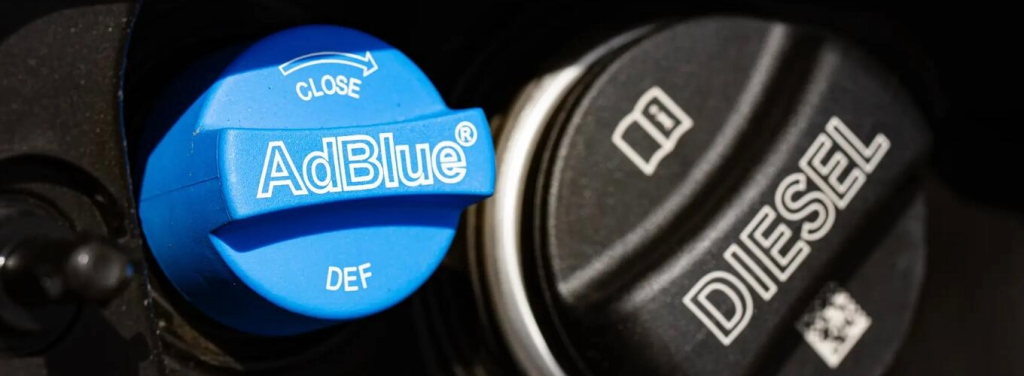 AdBlue cap next to diesel fuel cap.